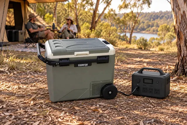 Eisberge fridge with a separate portable power station at a campsite.